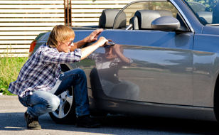 Car With Motor Cover From Chill Insurance Getting Broken Into