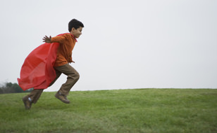 Boy Running Wearing A Cape